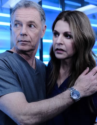 Holding Kit Back - Tall  - The Resident Season 3 Episode 20