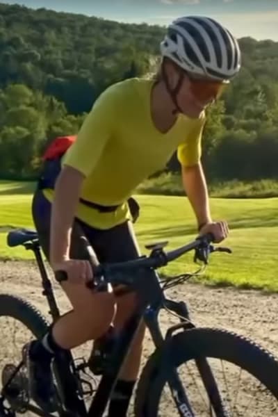 Mo Wilson in Yellow Rides Her Bike