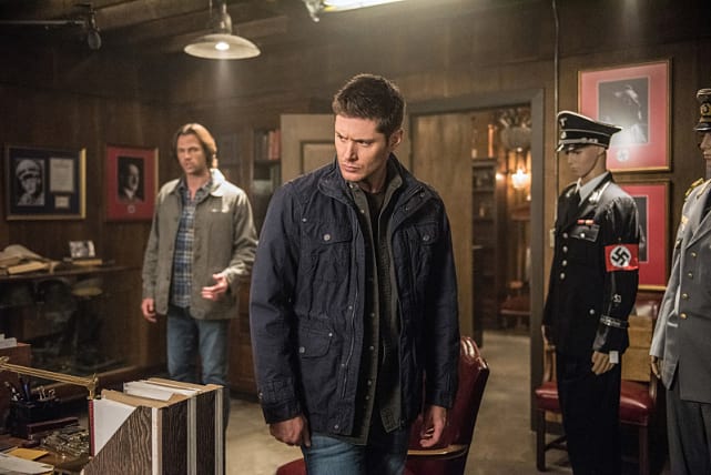 Dean diligently searches the room - Supernatural Season 12 Episode 5