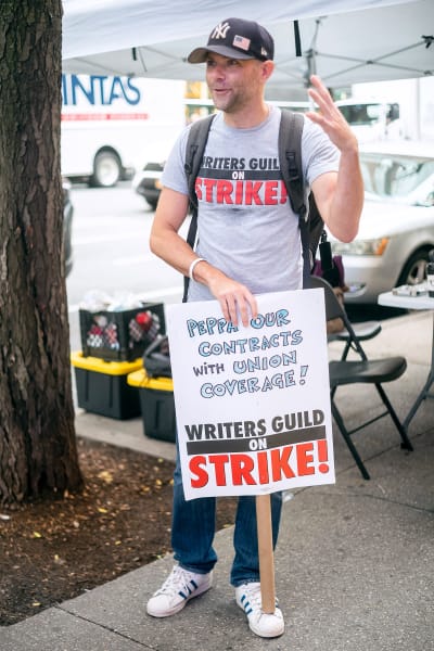 Actor Mikey Day joins members of the Writers Guild of America (WGA) walking a picket line outside of 