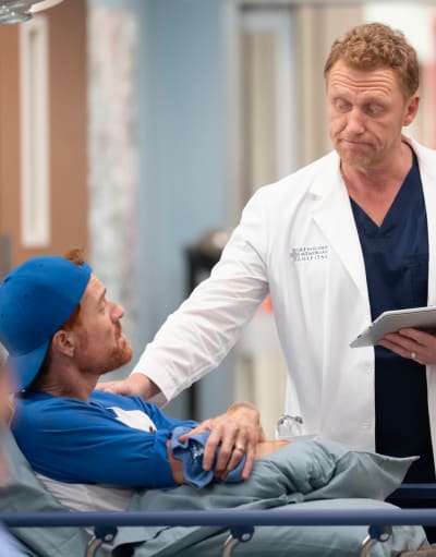 Checking Over a Patient - tall - Grey's Anatomy Season 20 Episode 2