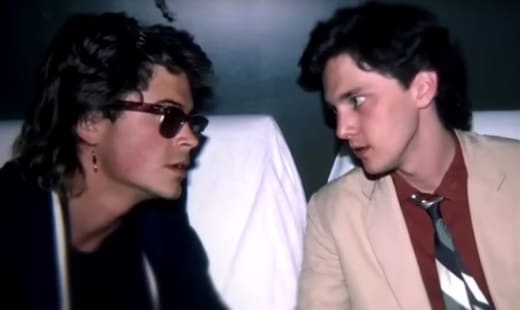 Young Rob Lowe and Andrew McCarthy Stare at Each Other