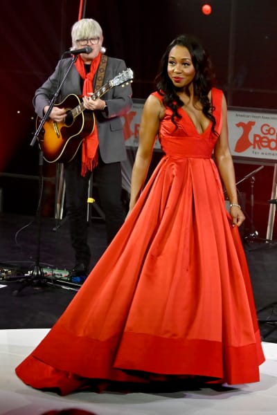 Amanda Warren walks the runway during The American Heart Association's Go Red for Women Red Dress Collection Concert 