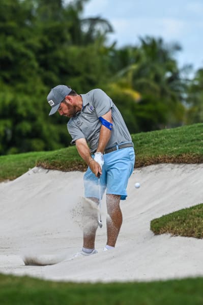 Team Captain Louis Oosthuizen, of Stinger GC, plays a shot from a bunker on the thirteenth hole
