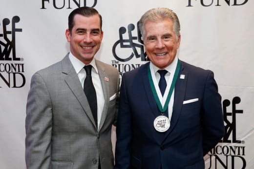 Callahan Walsh (L) and John Walsh (R) attend the 32nd Annual Great Sports Legends Dinner To Benefit The Miami Project/Buoniconti Fund To Cure Paralysis 