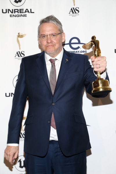 Adam McKay poses with an award at the Advanced Imaging Society's 12th Annual Lumiere Awards Ceremony