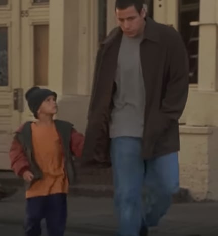 Adam Sandler and his adoptive kid 