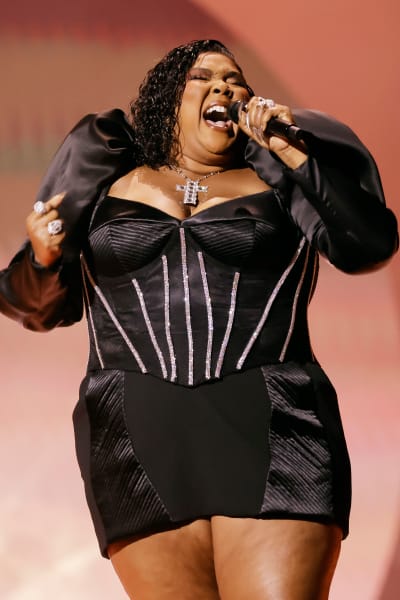 Lizzo (C) performs onstage during the 65th GRAMMY Awards