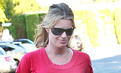 Rebecca Romijn Shows Off Baby Bump