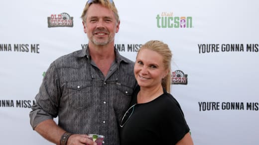 John Schneider and Alicia Allain attend 