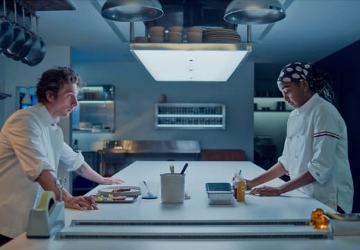 Carmy (Jeremy Allen White) and Sydney (Ayo Edebiri) in the kitchen on The Bear 