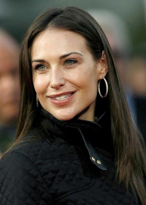 Claire Forlani's free-moving long hair with one side tucked behind