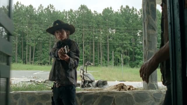Carl Brandishes a Pistol