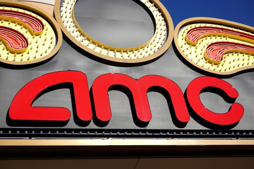 An AMC Theatres logo hangs above one of the company's movie theaters shuttered by the coronavirus COVID-19 