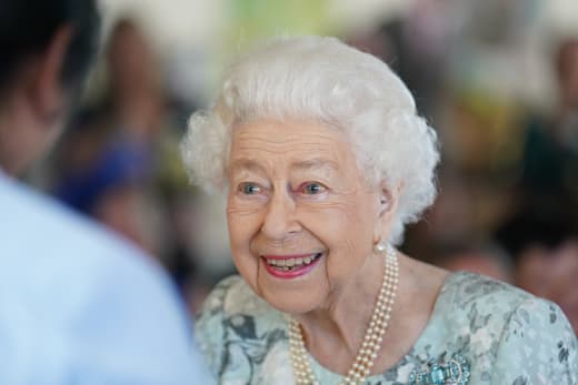 Queen Elizabeth II smiles during a visit to officially open the new building at Thames Hospice