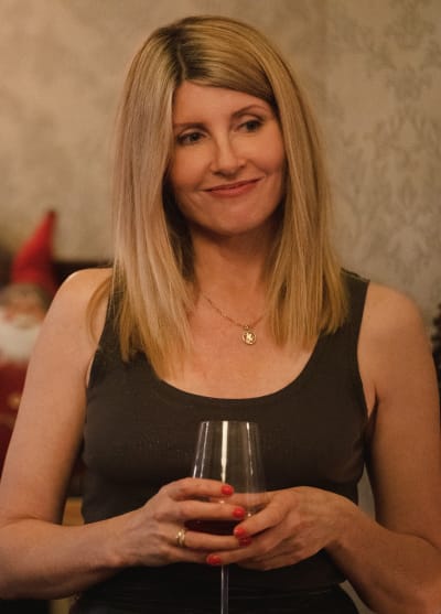Eva Cradles her Wine